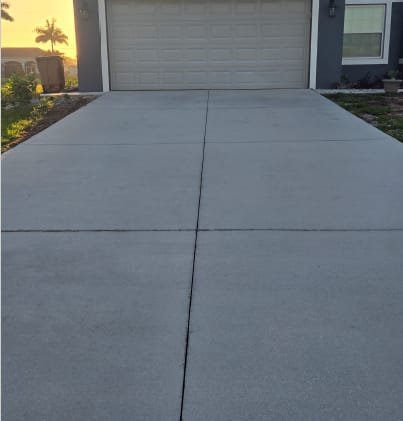 Driveway surface reviewed for prep considerations before nearby exterior painting work