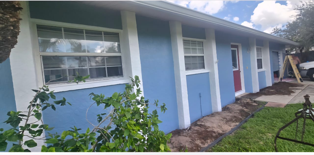 After photo of blue exterior painting on the side of a Southwest Florida single story home